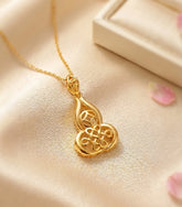 Gift of Gold - Wu Lou with Coin and Mystic Knot Pendant